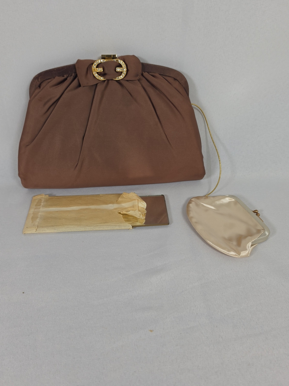 Ingber Rhinestone Clasp Evening Clutch Brown Satin Small Women
​The Hook